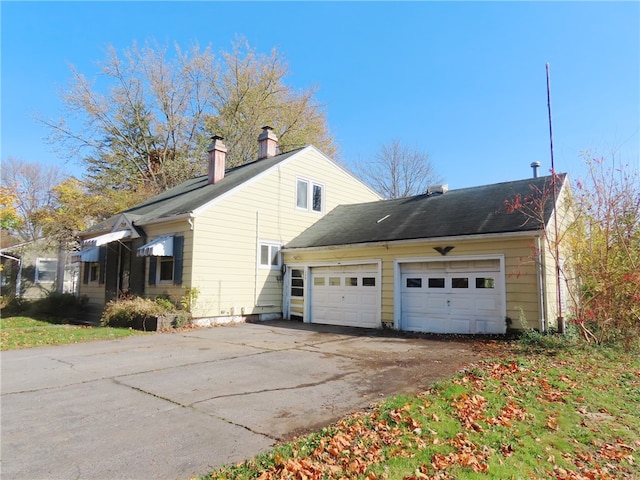 view of property exterior featuring a garage