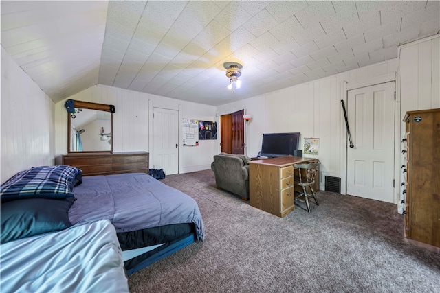 carpeted bedroom with vaulted ceiling