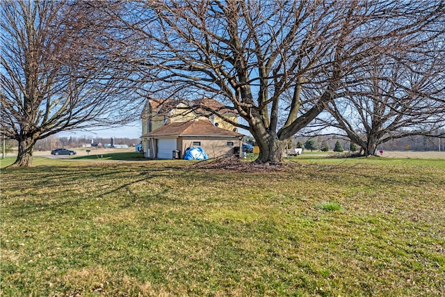 view of yard with a garage