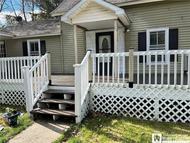 entrance to property featuring a deck