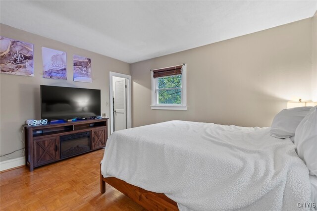 bedroom featuring light parquet flooring