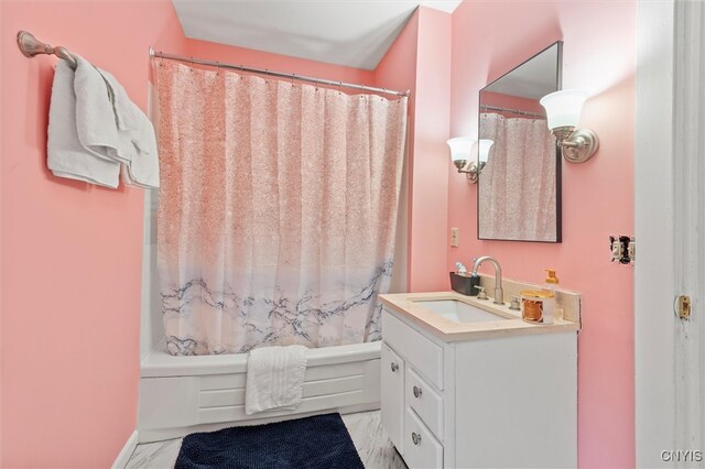 bathroom with shower / bath combo and vanity