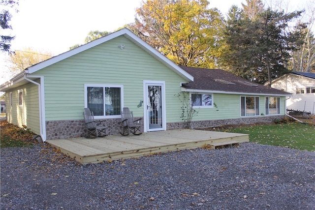 ranch-style house with a wooden deck