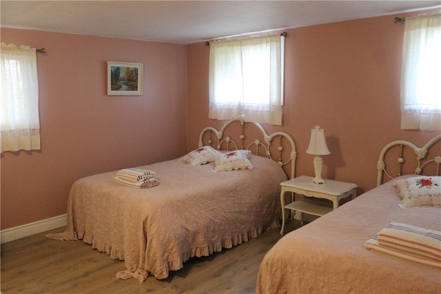 bedroom with hardwood / wood-style flooring