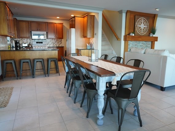 tiled dining room with sink