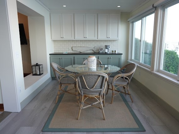 dining room with a wealth of natural light and light wood-type flooring