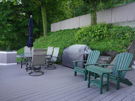 wooden terrace featuring grilling area