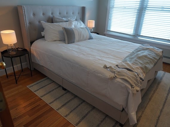 bedroom with hardwood / wood-style floors