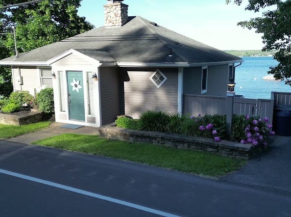 view of front of home featuring a water view