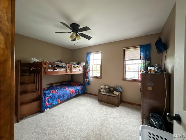 bedroom featuring ceiling fan and carpet floors