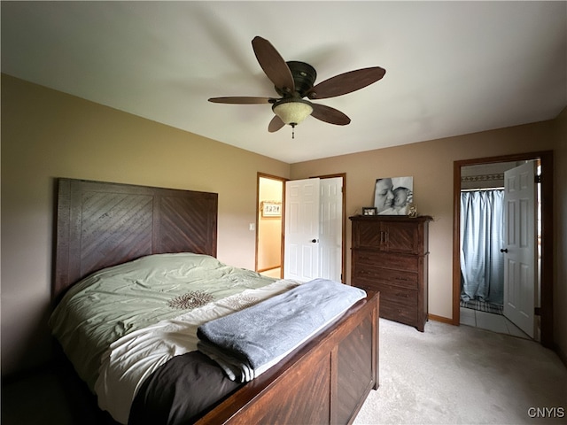 bedroom with light colored carpet and ceiling fan