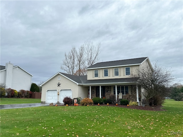 view of property with a front yard, a porch, and a garage