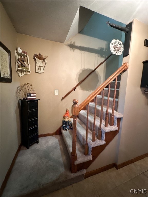 stairs with tile patterned flooring