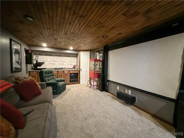 carpeted home theater with wooden ceiling