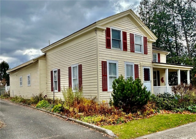 view of property exterior featuring a porch