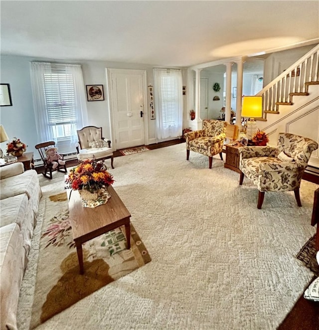 living room featuring ornate columns