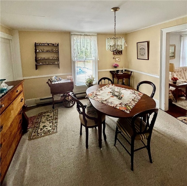 dining room with carpet floors and a chandelier