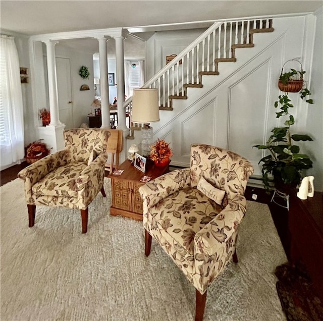 sitting room featuring ornate columns