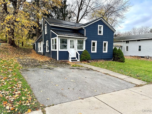 view of property featuring a front lawn