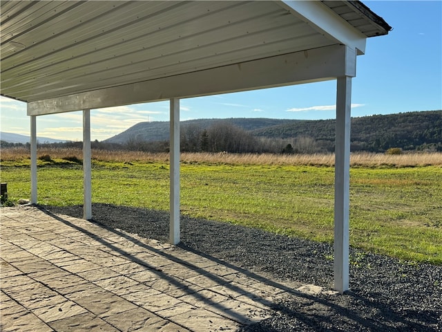 view of yard featuring a mountain view and a rural view