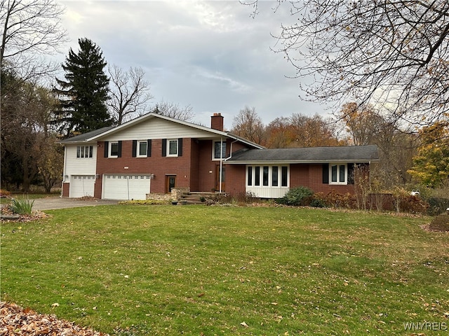 tri-level home with a garage and a front lawn