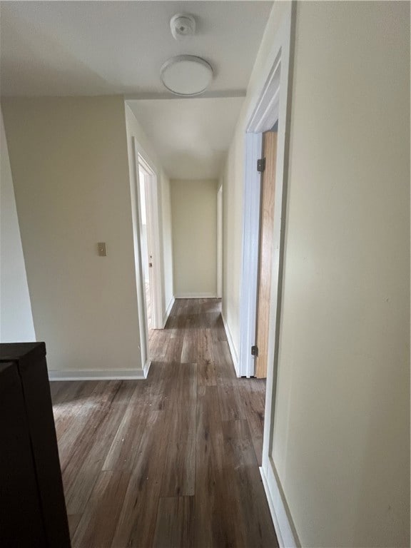 hallway featuring dark hardwood / wood-style floors