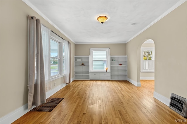 interior space featuring light hardwood / wood-style floors and crown molding