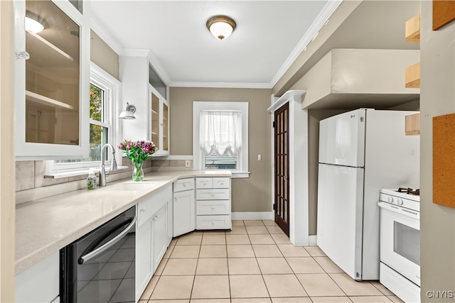 kitchen featuring light tile patterned floors, white appliances, white cabinetry, and sink