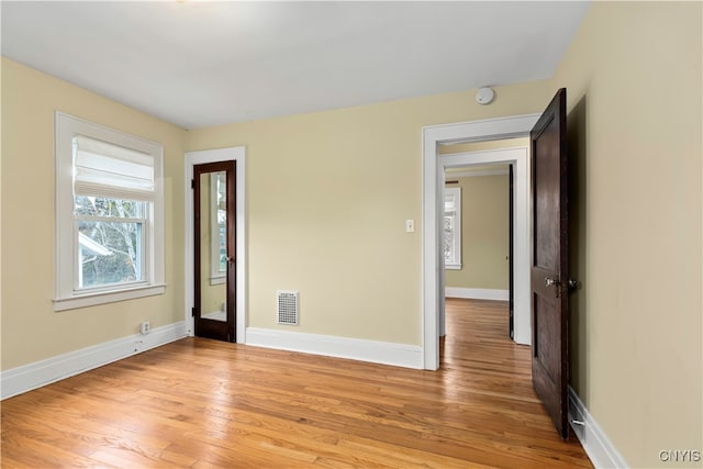 unfurnished room featuring light hardwood / wood-style flooring