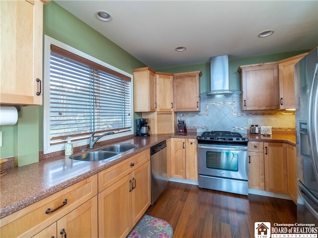 kitchen with stainless steel appliances, sink, light brown cabinetry, dark hardwood / wood-style floors, and wall chimney range hood