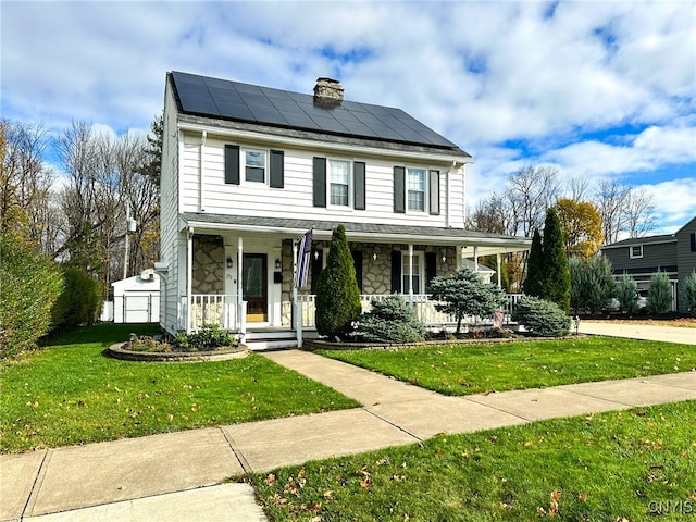 view of front of house with a porch, solar panels, and a front lawn