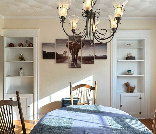 bedroom with wood-type flooring and a chandelier