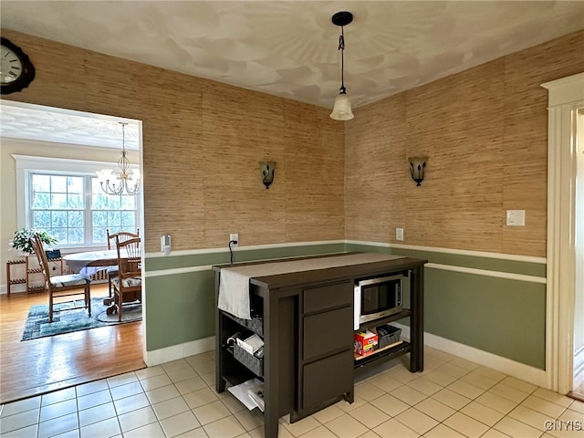 kitchen featuring a chandelier, decorative light fixtures, and light hardwood / wood-style floors