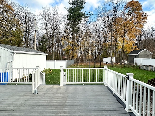 wooden deck featuring a yard