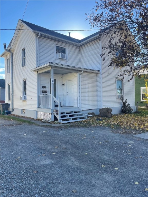 view of front of home featuring cooling unit and covered porch