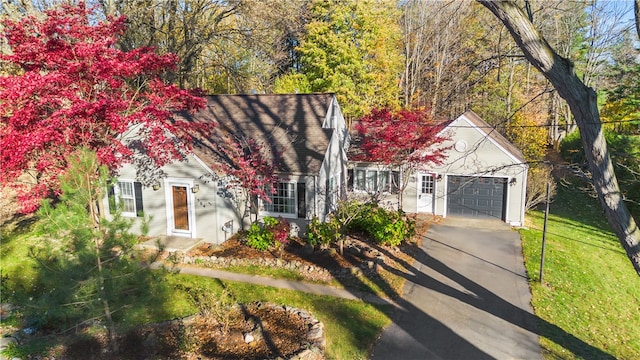 view of front of house with a front lawn and a garage