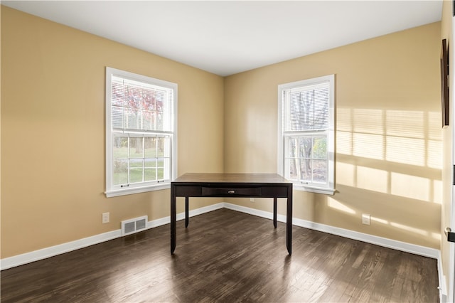 office with dark wood-type flooring