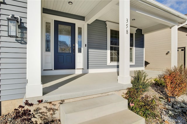 property entrance featuring covered porch