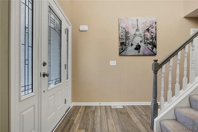 foyer with wood-type flooring