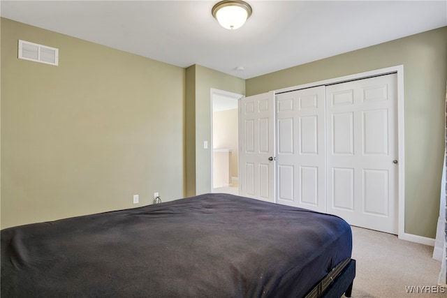 carpeted bedroom featuring a closet