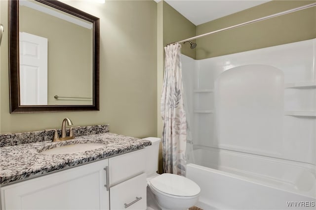 full bathroom with shower / bath combo, vanity, and toilet