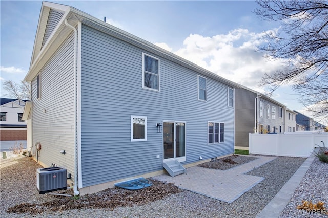 back of house featuring central AC