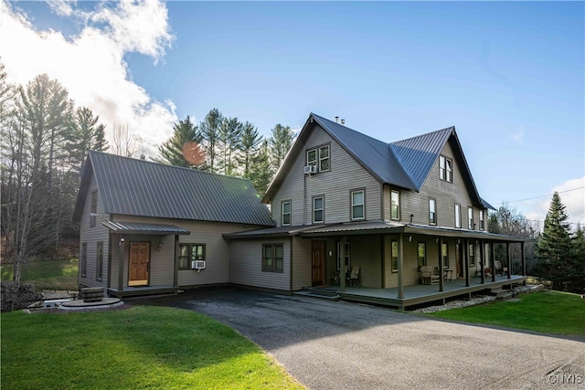 view of front of home with a front lawn and a porch