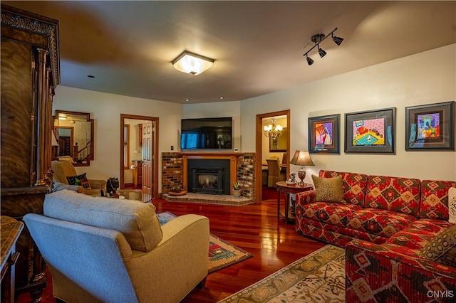 living room with hardwood / wood-style floors and a fireplace