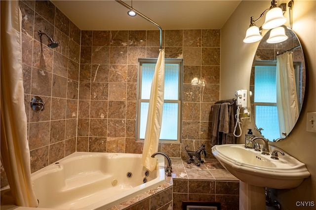 bathroom featuring sink and shower / tub combo with curtain