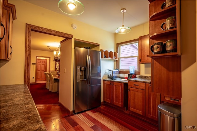 kitchen featuring a notable chandelier, decorative light fixtures, stainless steel fridge with ice dispenser, and dark parquet floors