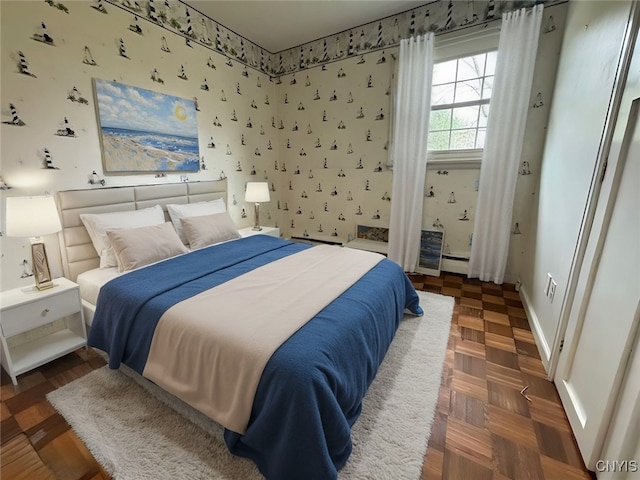 bedroom with dark parquet flooring