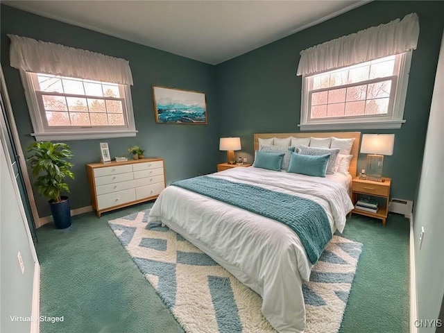 bedroom featuring baseboard heating and carpet