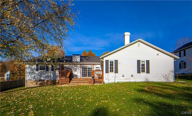 rear view of property with a yard