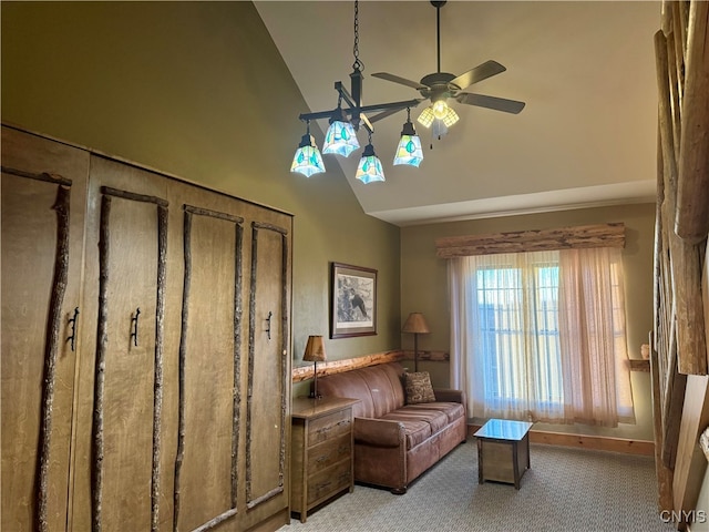 living area featuring high vaulted ceiling, light carpet, and ceiling fan